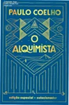 Capa dura da edição de luxo do livro O Alquimista de Paulo Coelho com detalhes em dourado